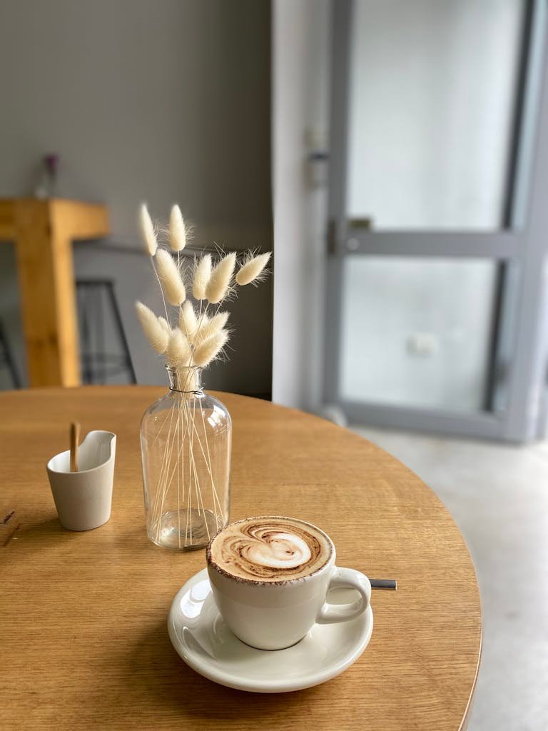 A comforting coffee experience in a minimalist café setting, perfect for a relaxed morning or coffee break.